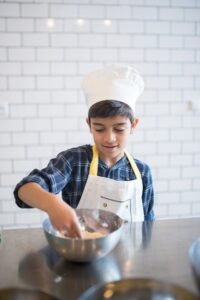 Children cooking, Judith Yeabsley|Fussy Eating NZ, boy scaping a bowl, #ChildrenCookingFussyEaters, #ChildrenCookingPickyEaters, #TryNewFoods, #TheConfidentEater, #FussyEatingNZ, #HelpForFussyEating, #HelpForFussyEaters, #FussyEater, #FussyEating, #PickyEater, #PickyEating, #SupportForFussyEaters, #SupportForPickyEaters, #CreatingConfidentEaters, #TryNewFood #PickyEatingNZ #HelpForPickyEaters, #HelpForPickyEating, #Wellington, #NZ, #JudithYeabsley #RecipesPickyEatersWillEat, #RecipesFussyEatersWillEat