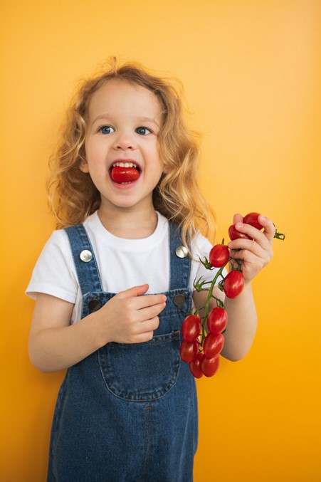 Girl with tomatoes – eating essentials, Judith Yeabsley|Fussy Eating NZ, #TheConfidentEater, #FussyEatingNZ, #TryNewFoods #HelpForFussyEating, #HelpForFussyEaters, #FussyEater, #FussyEating, #PickyEater, #PickyEating, #SupportForFussyEaters, #SupportForPickyEaters, #CreatingConfidentEaters, #TryNewFood #PickyEatingNZ #HelpForPickyEaters, #HelpForPickyEating, #Wellington, #NZ, #JudithYeabsley